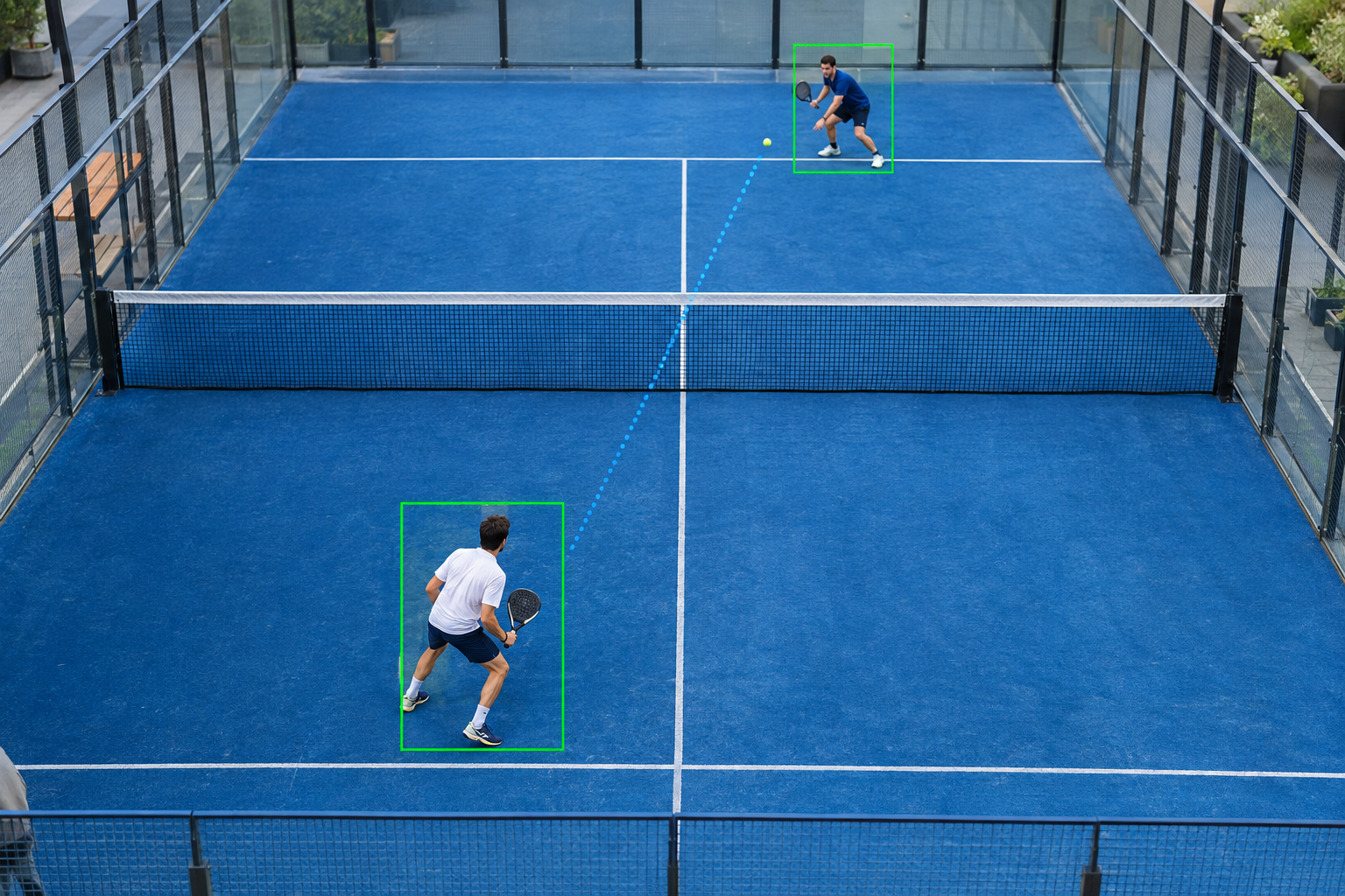 Camera on a tripod set up behind an indoor padel court, ready to record the match